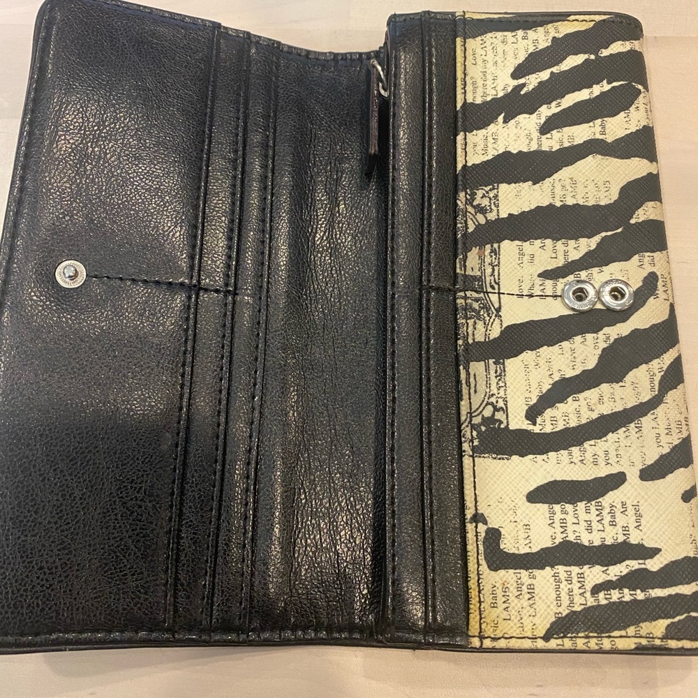 L.A.M.B. by Gwen Stefani Zebra/newsprint wallet.  Excellent pre-loved condition.